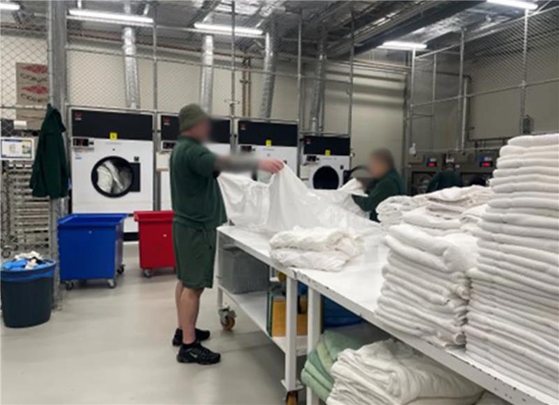 Inmates folding washing
